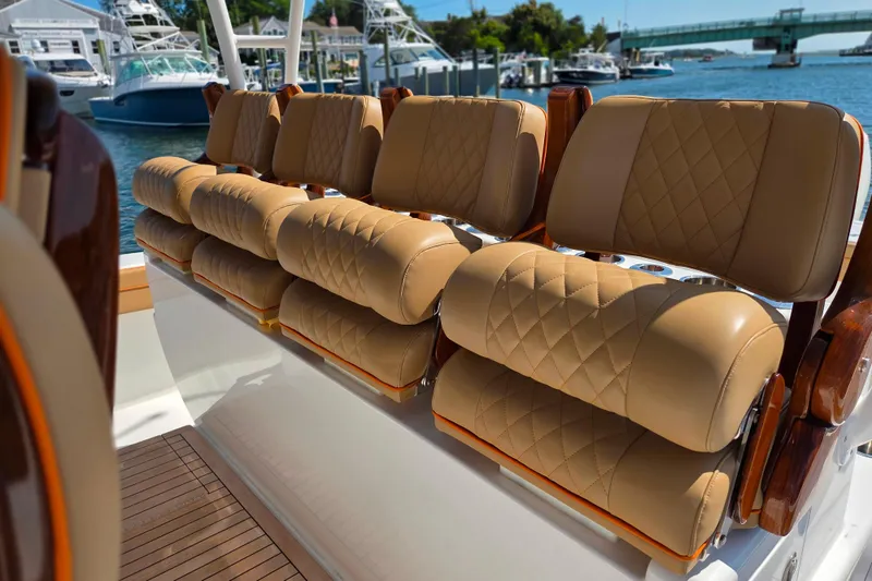 Slide: The Image of Luxurious seating on 2023 Valhalla Boatworks V-46, featuring tan quilted upholstery. - 32