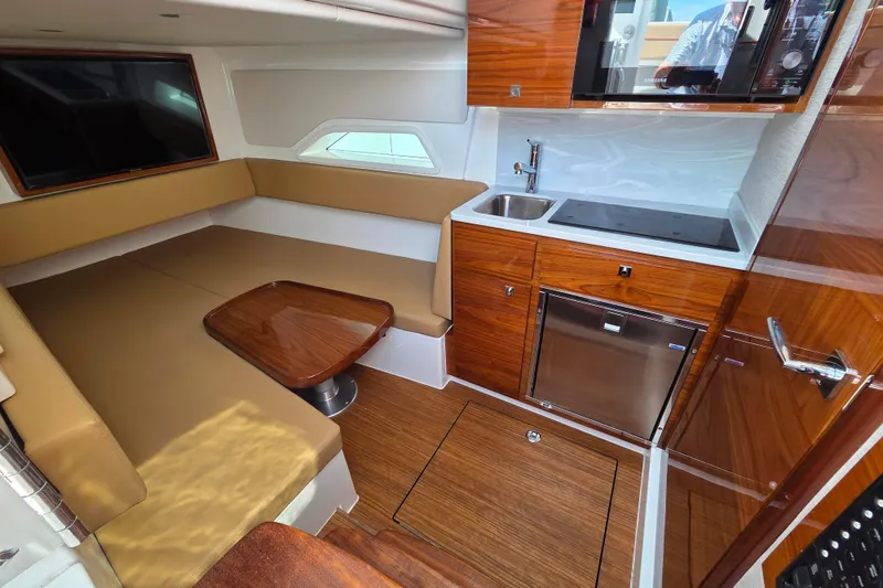 Slide: The Image of Luxurious interior of 2023 Valhalla Boatworks V-46 with kitchenette and seating area. - 38