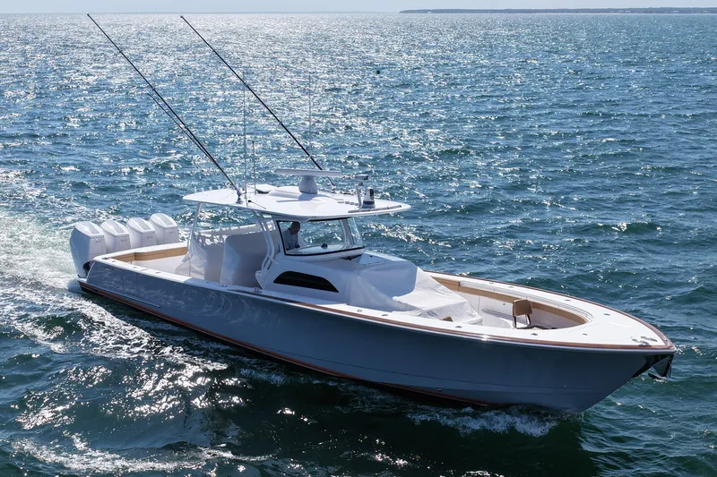 Slide: The Image of 2023 Valhalla Boatworks V-46 cruising on open water, showcasing sleek design and powerful engines. - 4