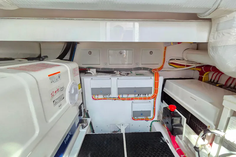 Slide: The Image of Engine room of 2023 Valhalla Boatworks V-46, showcasing organized wiring and equipment. - 41