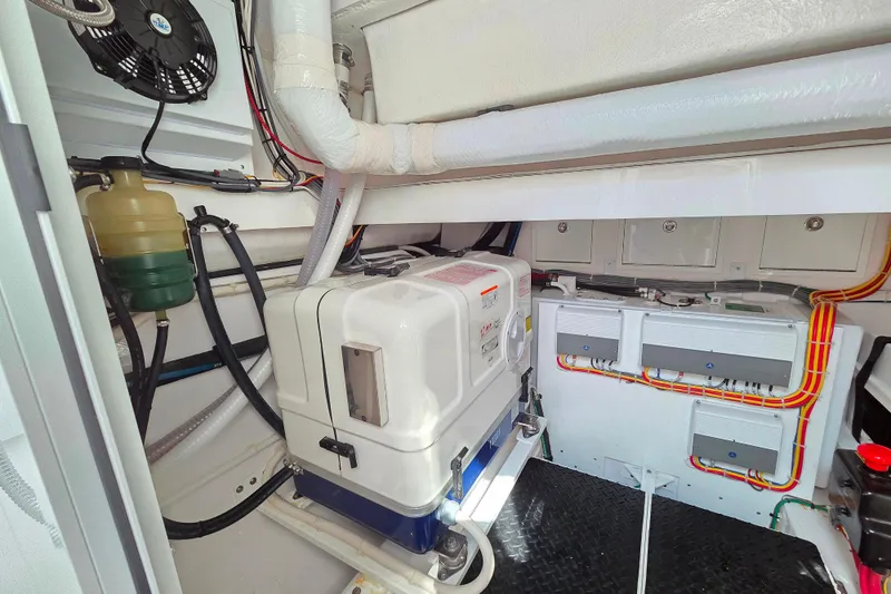 Slide: The Image of Engine room of 2023 Valhalla Boatworks V-46, featuring equipment and wiring. - 44