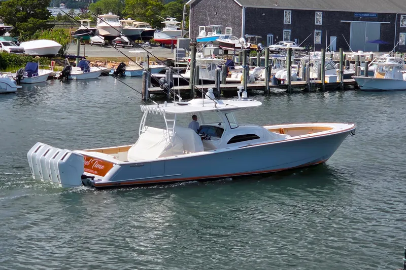 Slide: The Image of 2023 Valhalla Boatworks V-46 cruising in a marina, surrounded by other boats. - 45
