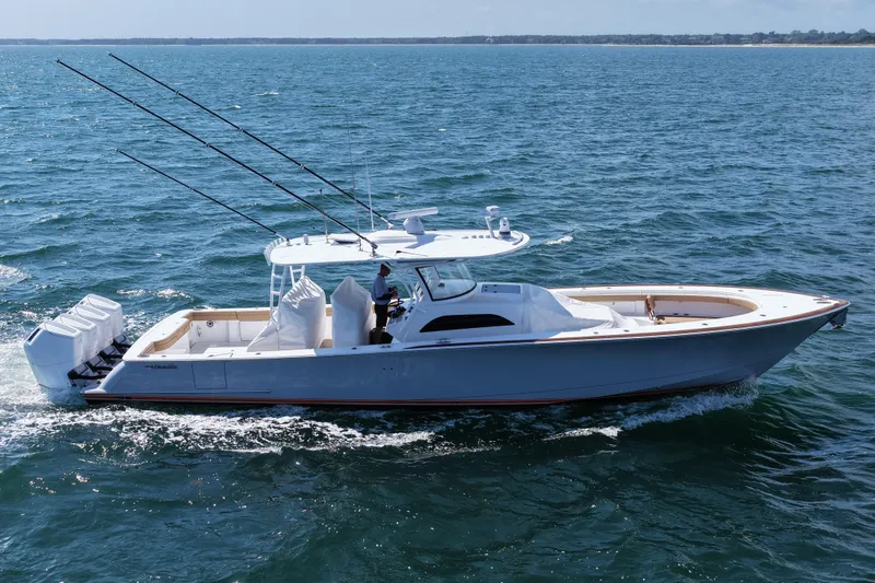 Slide: The Image of 2023 Valhalla Boatworks V-46 cruising on open water, featuring sleek design and powerful engines. - 5