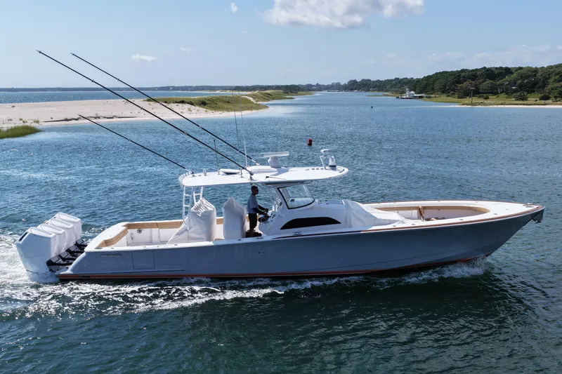 Slide: The Image of 2023 Valhalla Boatworks V-46 cruising on a scenic waterway with fishing rods. - 9