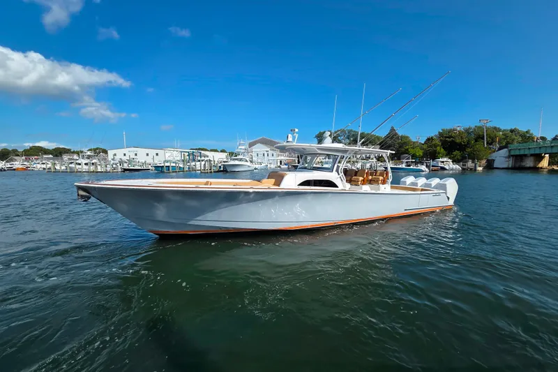 The Image of 2023 Valhalla Boatworks V-46 cruising on a sunny day near a marina. - 0