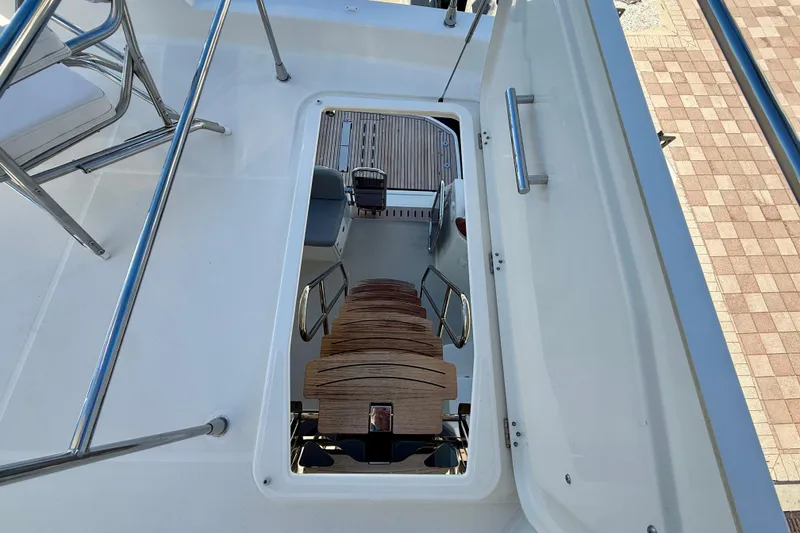 Slide: The Image of Staircase view on 2023 Beneteau Swift Trawler 48, showcasing sleek design and craftsmanship. - 9