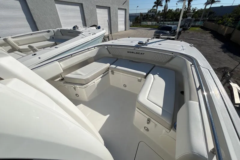 Slide: The Image of 2026 World Cat 265 CC-X boat interior with white seating and sleek design. - 5