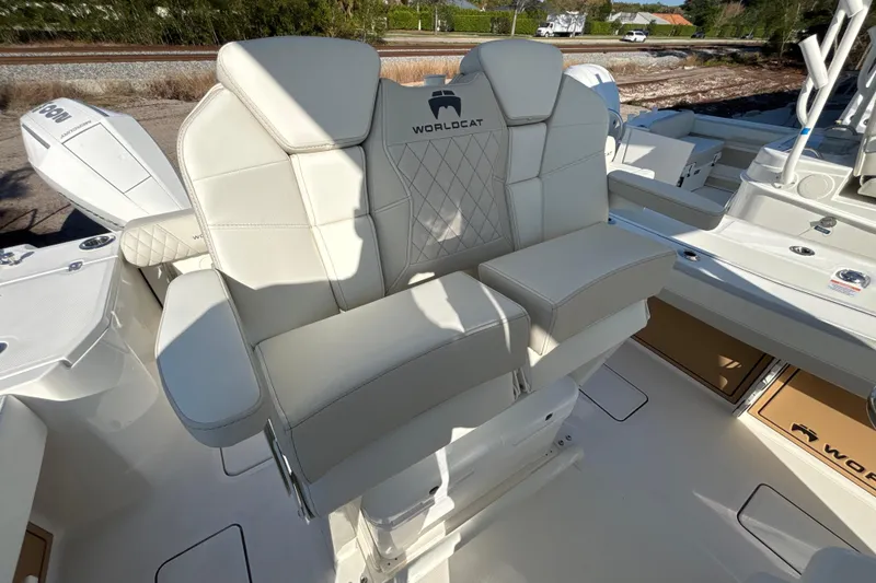 Slide: The Image of 2026 World Cat 265 CC-X boat with luxurious white seating and modern design. - 6