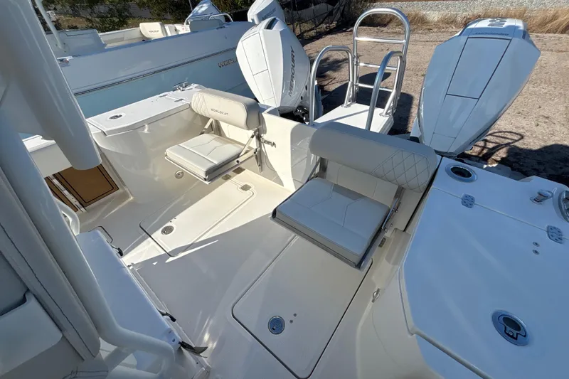 Slide: The Image of 2026 World Cat 265 CC-X boat interior with seating and dual outboard engines. - 7