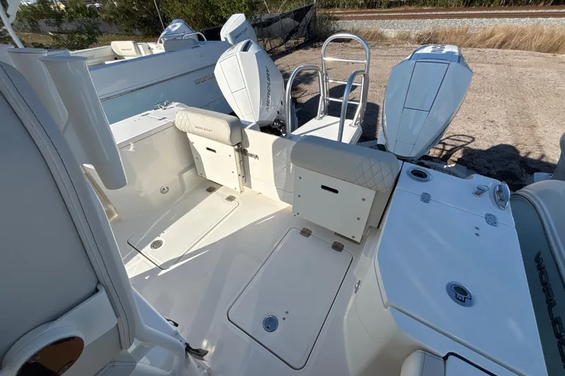 Slide: The Image of 2026 World Cat 265 CC-X boat interior with seating and dual outboard engines. - 8