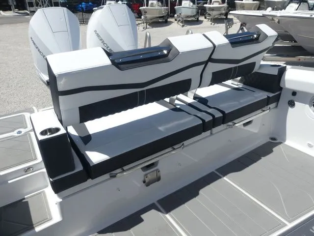 Slide: The Image of 2026 Monterey Elite 30 OB boat rear seating and engines. - 11