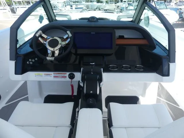 Slide: The Image of Cockpit of 2026 Monterey Elite 30 OB with modern steering and display. - 14