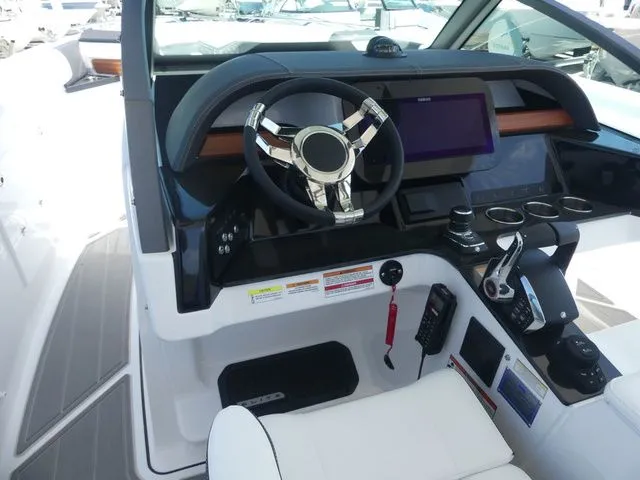 Slide: The Image of 2026 Monterey Elite 30 OB cockpit with modern steering and electronics. - 15