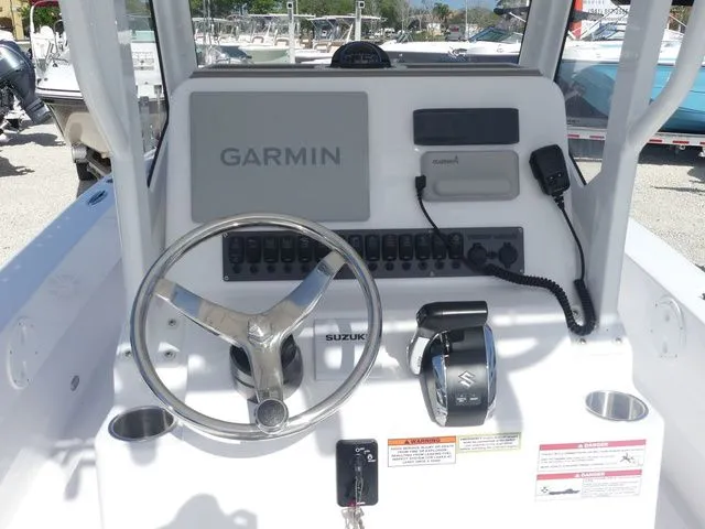 Slide: The Image of Twin Vee 220 Baycat 2026 helm with Garmin navigation system. - 17