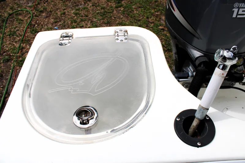 Slide: The Image of 2008 Sailfish 2660 CC boat with Yamaha 150 engine and livewell. - 11