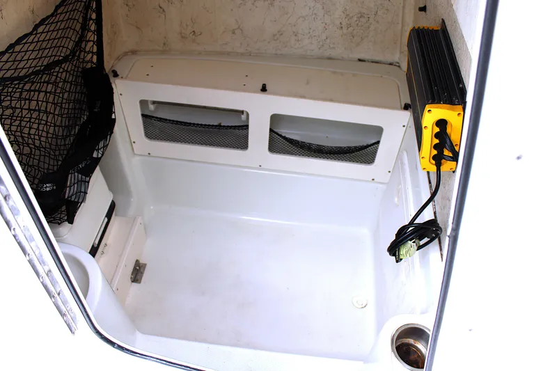 Slide: The Image of 2008 Sailfish 2660 CC boat interior with storage net and mounted equipment. - 13