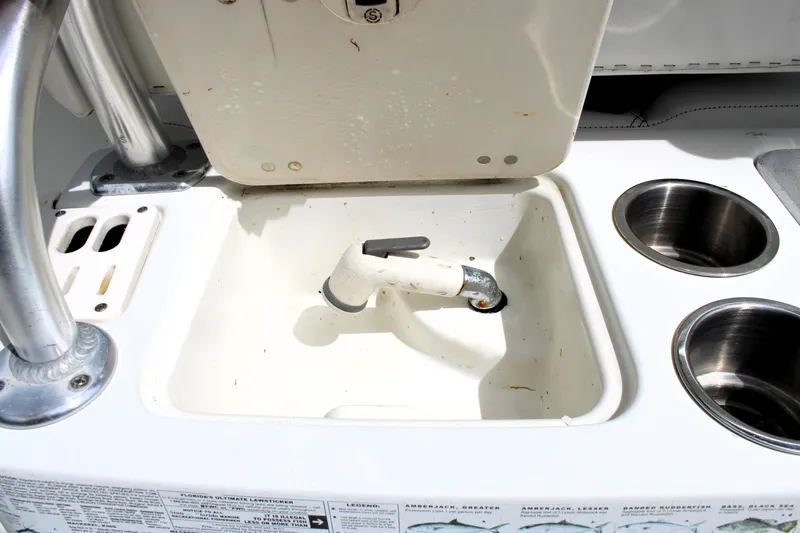 Slide: The Image of 2008 Sailfish 2660 CC boat sink and cup holders on deck. - 15