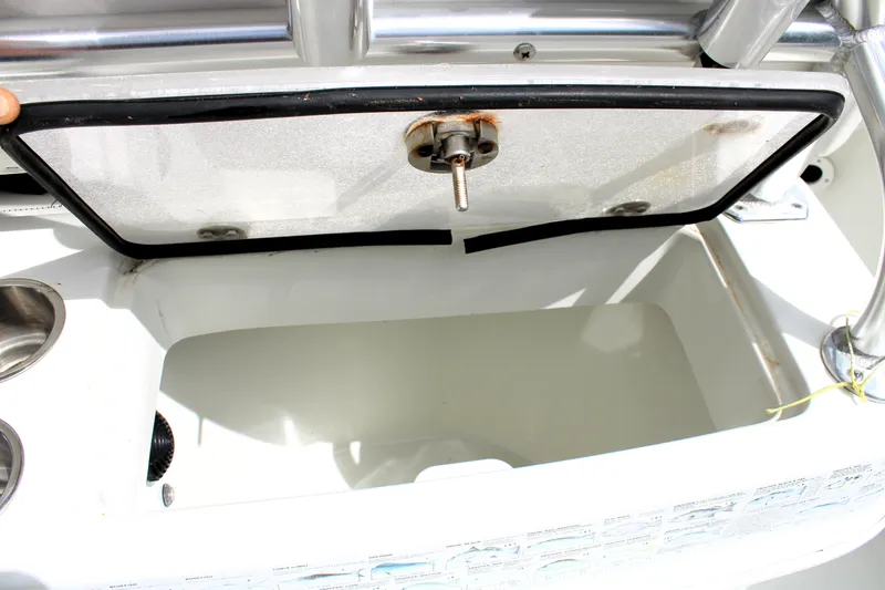 Slide: The Image of Open storage compartment on 2008 Sailfish 2660 CC boat, showing interior details. - 16
