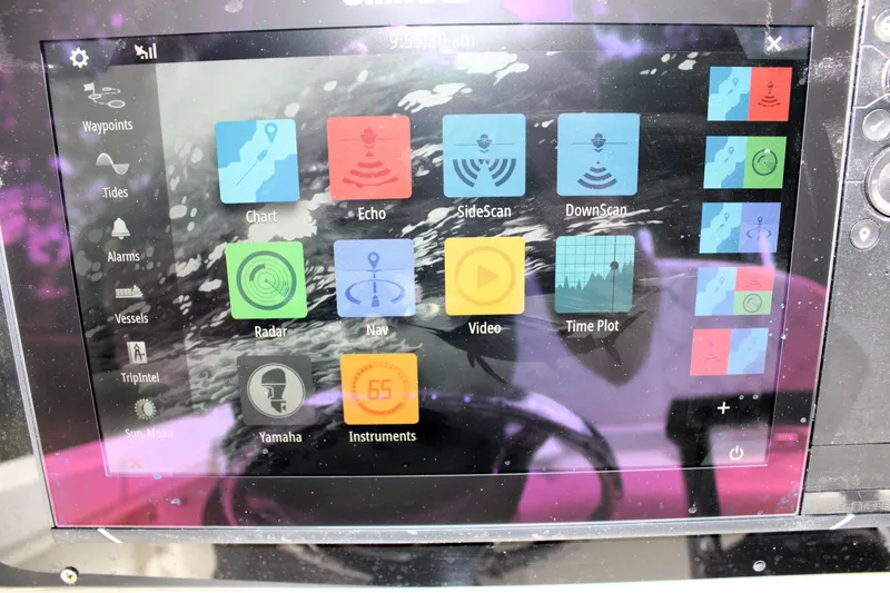 Slide: The Image of Boat navigation system display with various function icons on a Sailfish 2660 CC, 2008 model. - 20