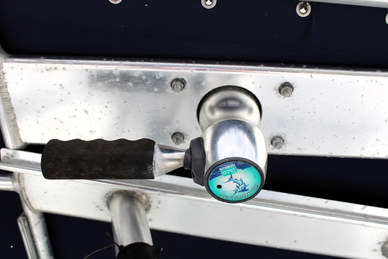 Slide: The Image of Close-up of a 2008 Sailfish 2660 CC boat handle with logo. - 25