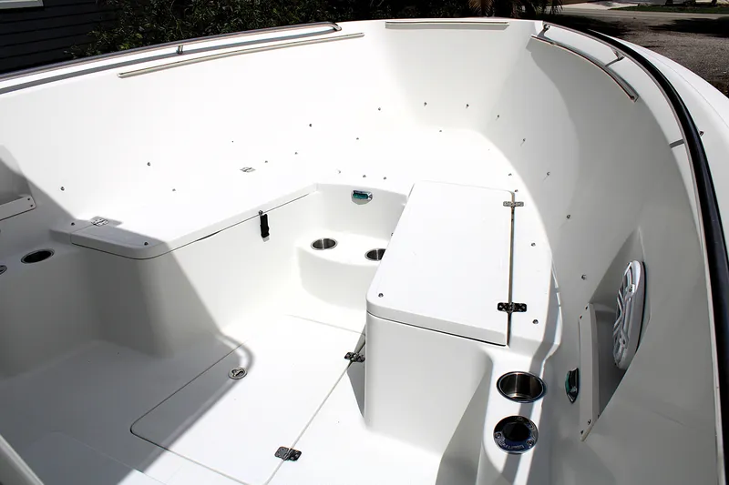 Slide: The Image of 2008 Sailfish 2660 CC boat interior with seating and storage compartments. - 32