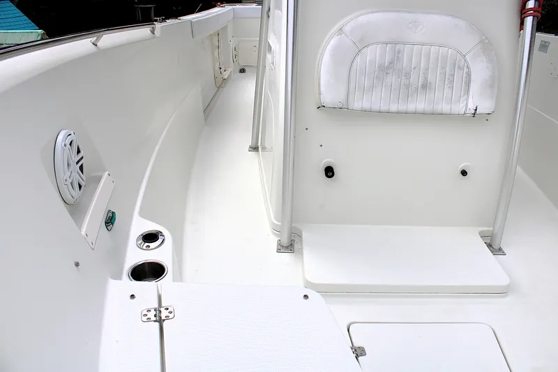 Slide: The Image of 2008 Sailfish 2660 CC boat interior with seating and cup holders. - 35