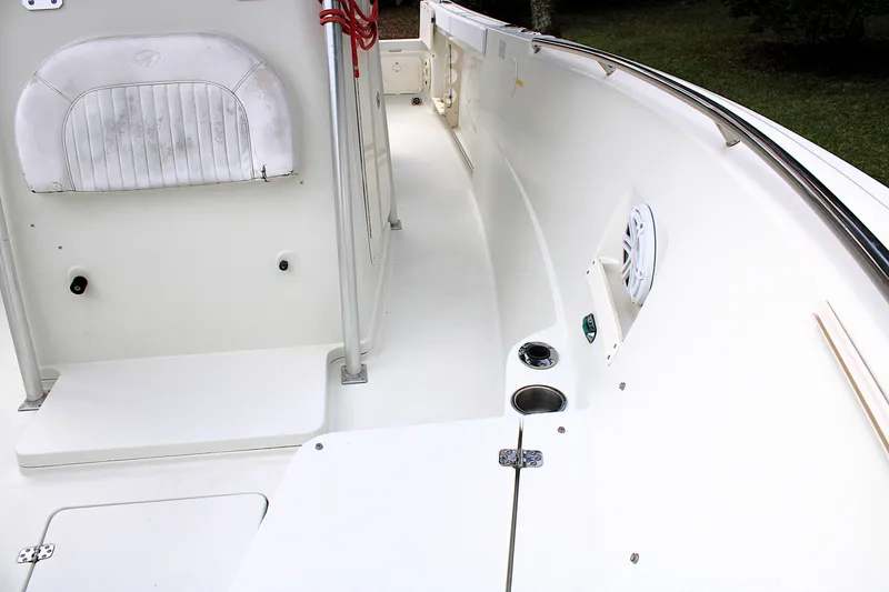 Slide: The Image of 2008 Sailfish 2660 CC boat interior with seating, cup holders, and speaker. - 36