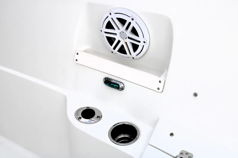 Slide: The Image of 2008 Sailfish 2660 CC boat interior with speaker and cup holder. - 37