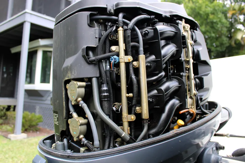 Slide: The Image of Close-up of a 2008 Sailfish 2660 CC boat engine, showcasing intricate mechanical components. - 39