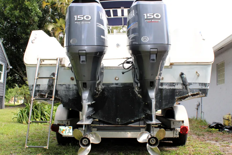 Slide: The Image of 2008 Sailfish 2660 CC boat with dual Yamaha 150 four-stroke engines on a trailer. - 4