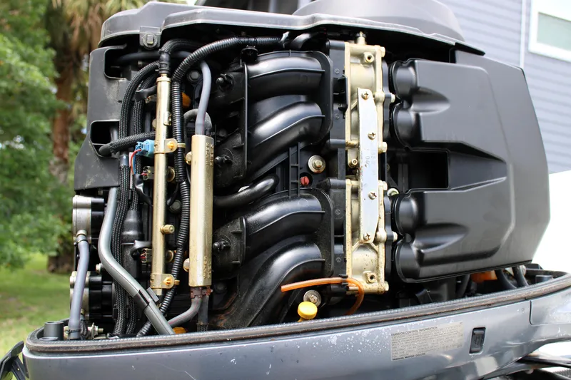 Slide: The Image of Close-up of a 2008 Sailfish 2660 CC boat engine, showcasing intricate components. - 40