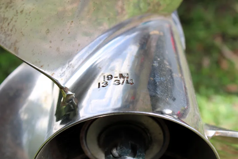 Slide: The Image of Close-up of a Sailfish 2660 CC 2008 boat propeller with engraved specifications. - 42