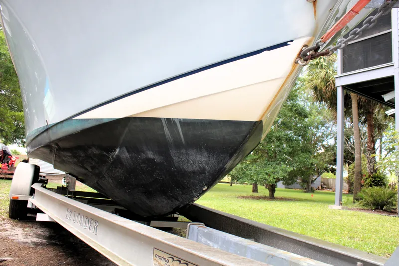 Slide: The Image of 2008 Sailfish 2660 CC boat on trailer, parked outdoors. - 6