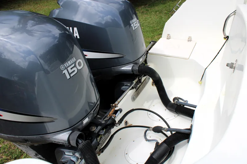 Slide: The Image of Twin Yamaha 150 engines on a 2008 Sailfish 2660 CC boat. - 8
