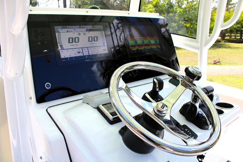 Slide: The Image of 2021 Sportsman Open 282 Center Console dashboard with steering wheel and digital displays. - 10