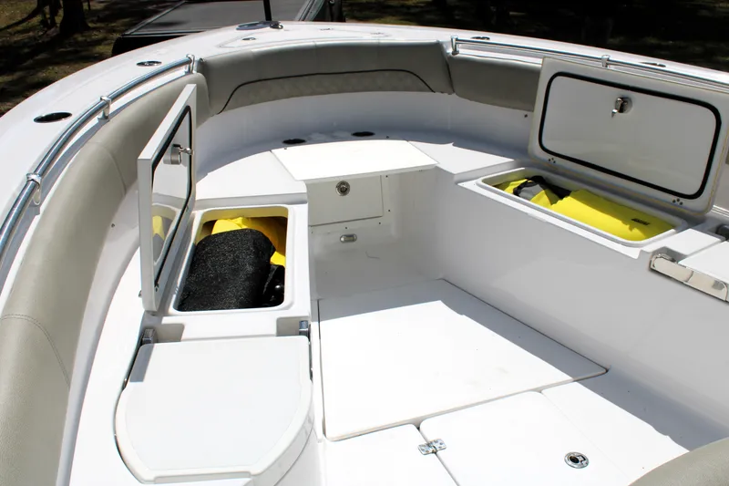 Slide: The Image of 2021 Sportsman Open 282 Center Console boat interior with open storage compartments. - 14