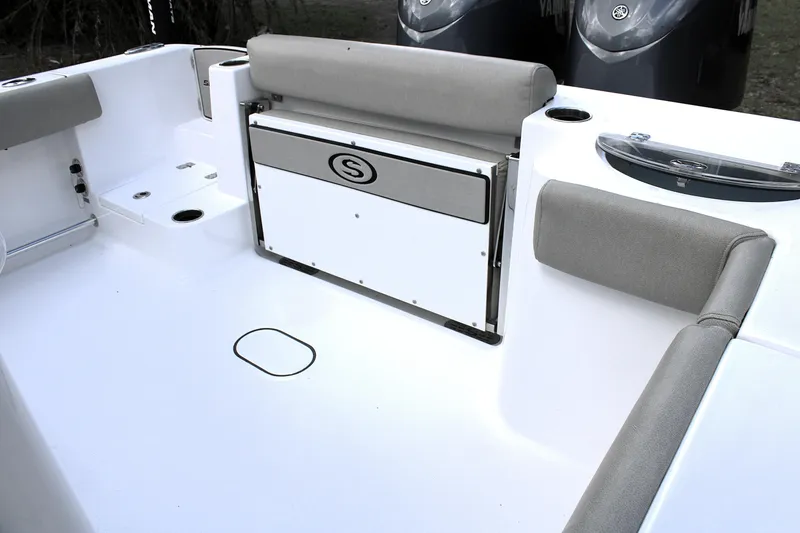 Slide: The Image of 2021 Sportsman Open 282 Center Console boat interior with cushioned seating and storage. - 15