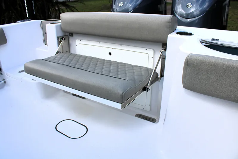 Slide: The Image of 2021 Sportsman Open 282 Center Console boat with foldable cushioned seating. - 16