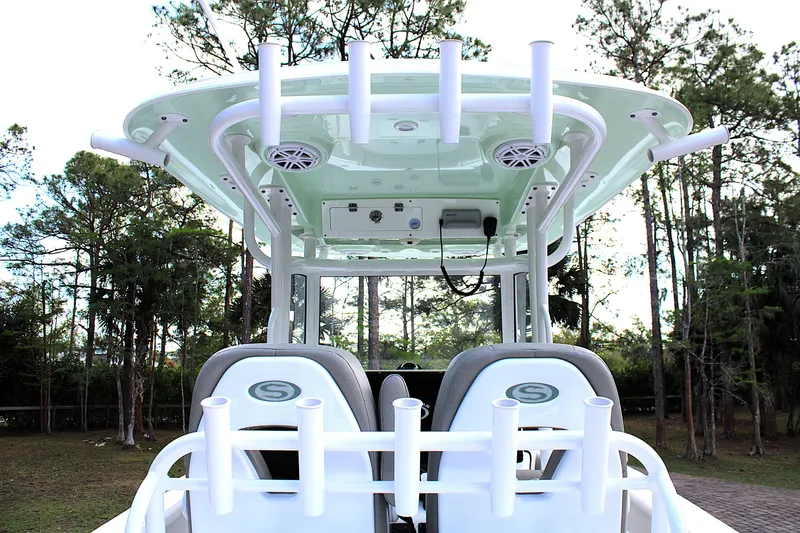 Slide: The Image of 2021 Sportsman Open 282 Center Console boat with rod holders and speakers. - 18