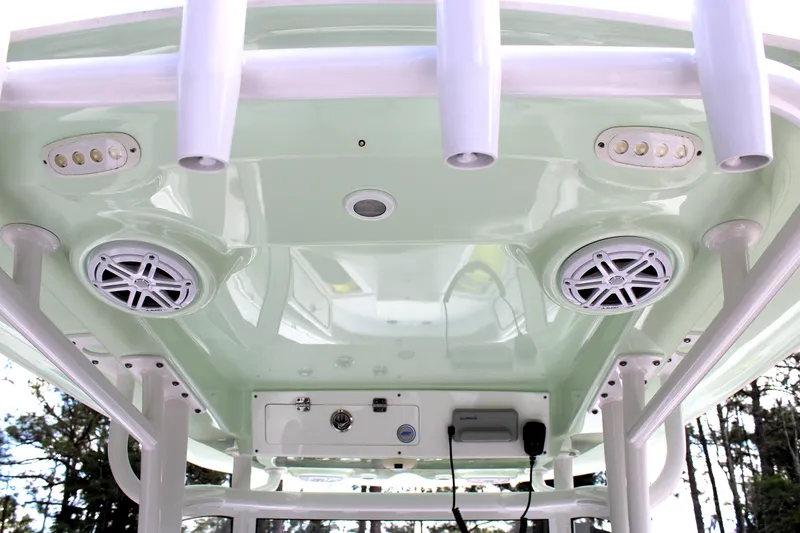 Slide: The Image of 2021 Sportsman Open 282 Center Console boat roof with speakers and rod holders. - 19