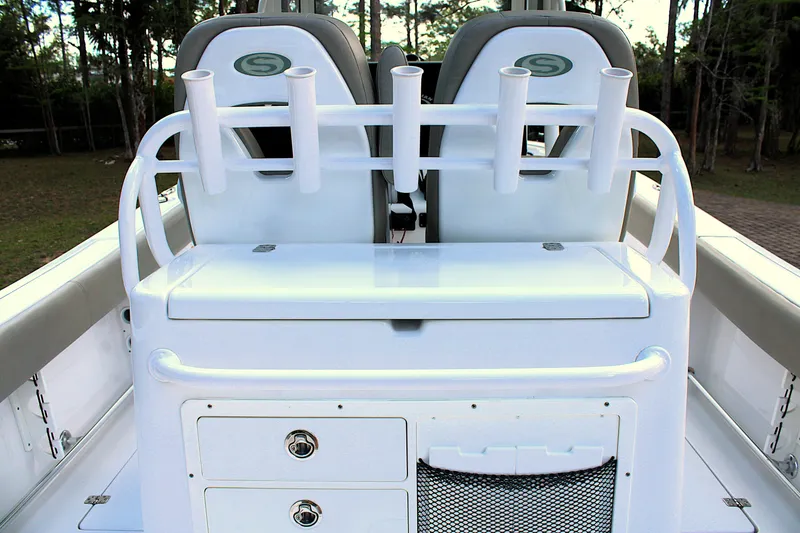 Slide: The Image of 2021 Sportsman Open 282 Center Console boat with rod holders and storage compartments. - 22