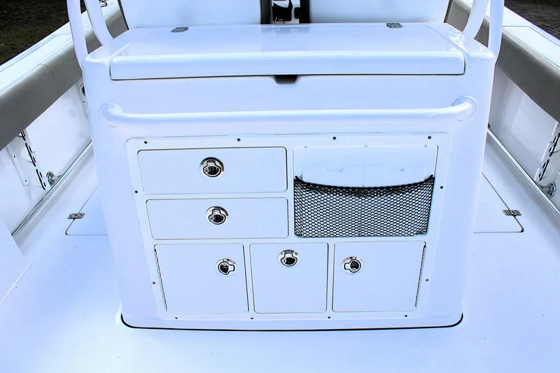 Slide: The Image of 2021 Sportsman Open 282 Center Console storage area with drawers and netting. - 23