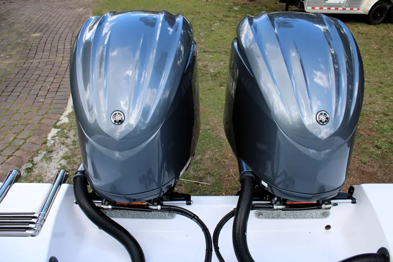 Slide: The Image of Twin Yamaha outboard engines on a 2021 Sportsman Open 282 Center Console boat. - 32