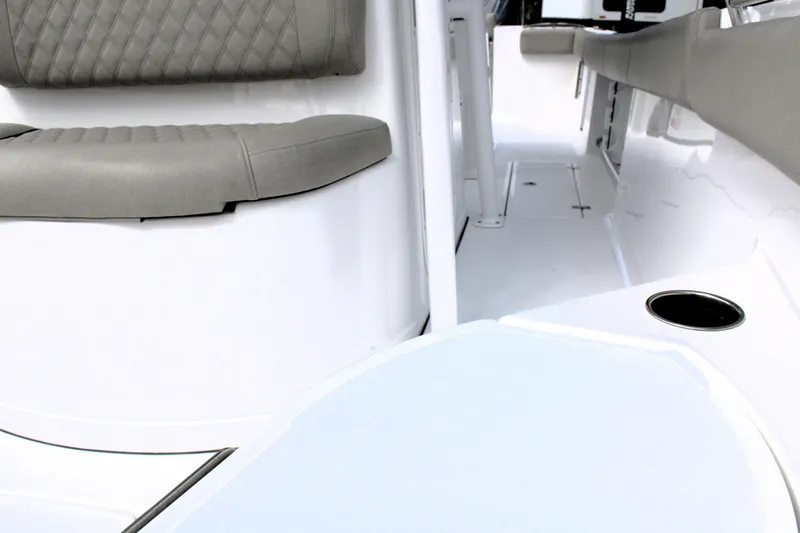 Slide: The Image of Interior view of 2021 Sportsman Open 282 Center Console boat with cushioned seating. - 36