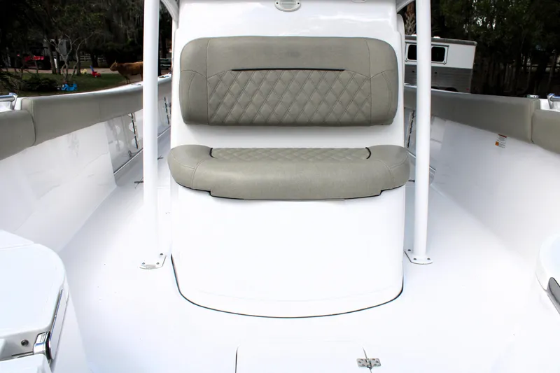 Slide: The Image of 2021 Sportsman Open 282 Center Console boat interior with cushioned seating. - 38