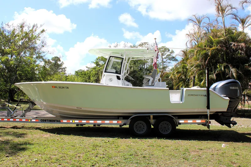 Slide: The Image of 2021 Sportsman Open 282 Center Console boat on trailer, parked outdoors. - 4