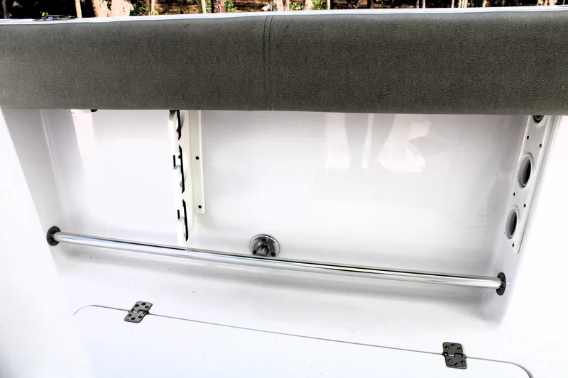 Slide: The Image of 2021 Sportsman Open 282 Center Console interior detail with rod holders and cushioned seating. - 42