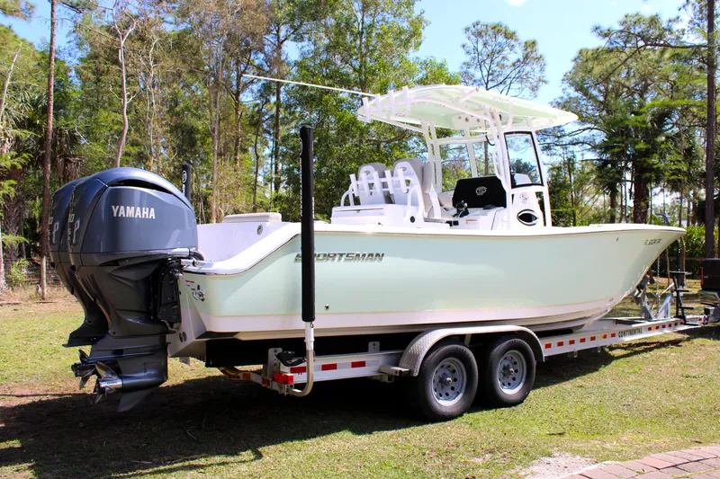 Slide: The Image of 2021 Sportsman Open 282 Center Console boat on trailer, featuring Yamaha engines. - 6
