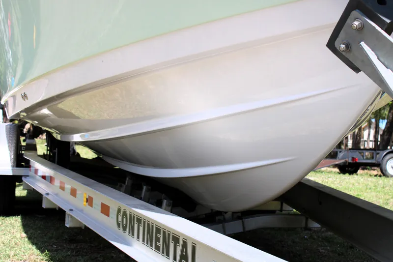 Slide: The Image of 2021 Sportsman Open 282 Center Console boat on trailer, showcasing hull design. - 7