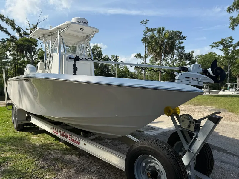 Slide: The Image of 2023 SeaHunter 28 Floridian boat on trailer, parked outdoors. - 10